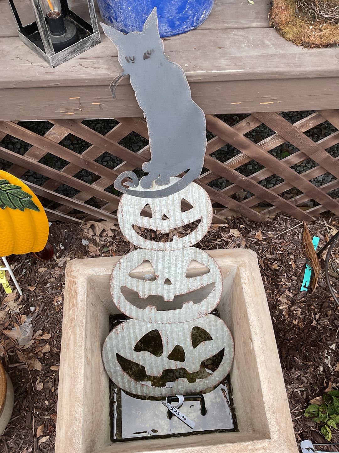 Stacking metal pumpkins with cat